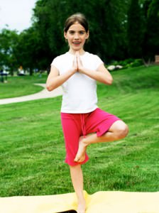 Standing Child in a Yoga Pose